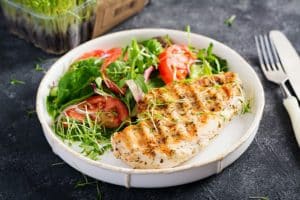 Grilled chicken fillet with salad. Keto, ketogenic, paleo diet. Healthy food. Diet lunch concept.