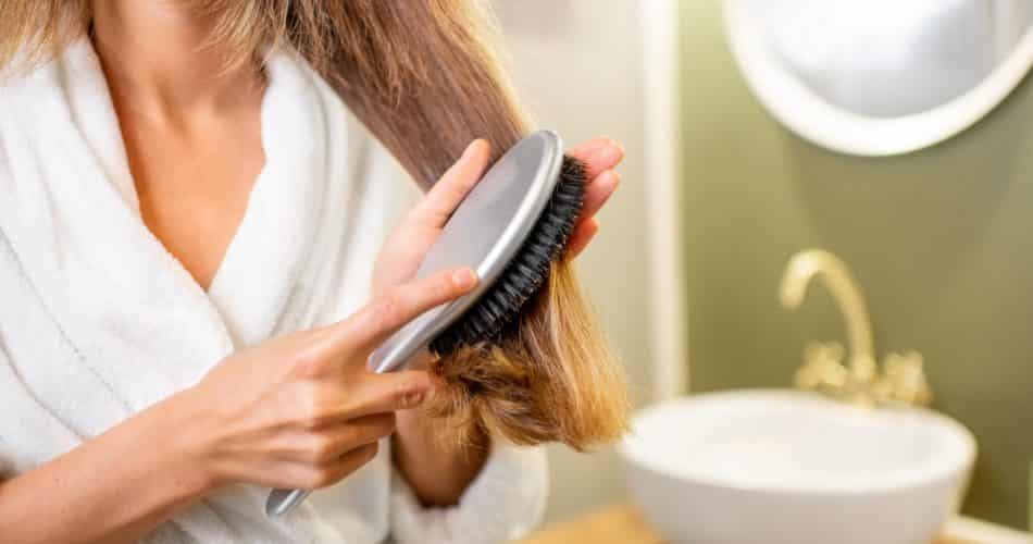 Combing hair in the bathroom